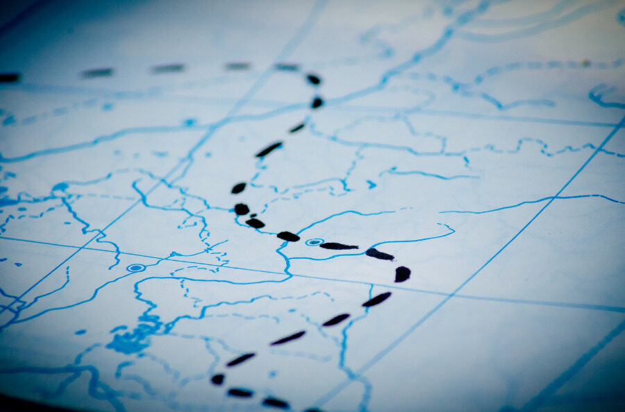 Close up view of a map with a route traced in dotted lines.