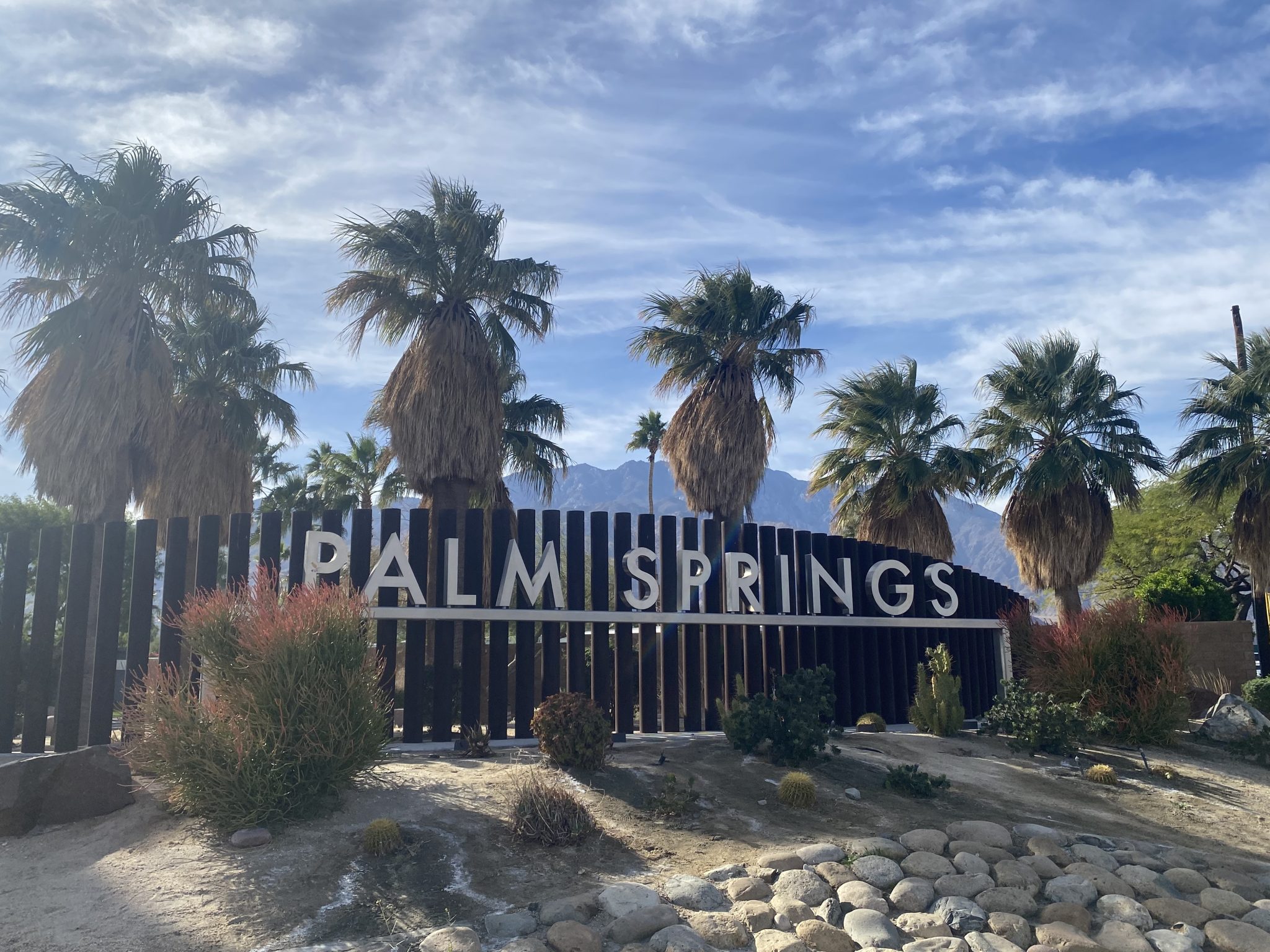 Capture of a stunning twilight sky with colorful gradients over gentle hills.