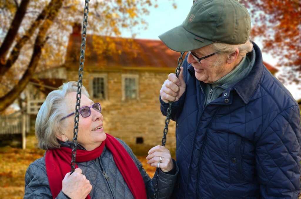 elderly couple looking each other