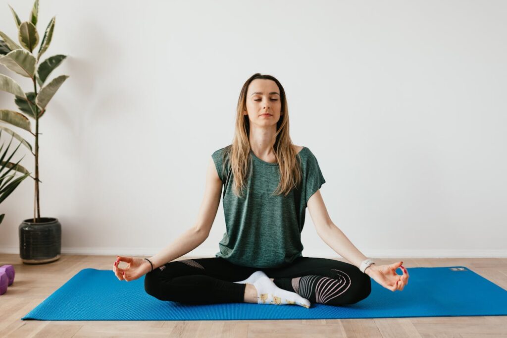 girl sitting at a yoga pose