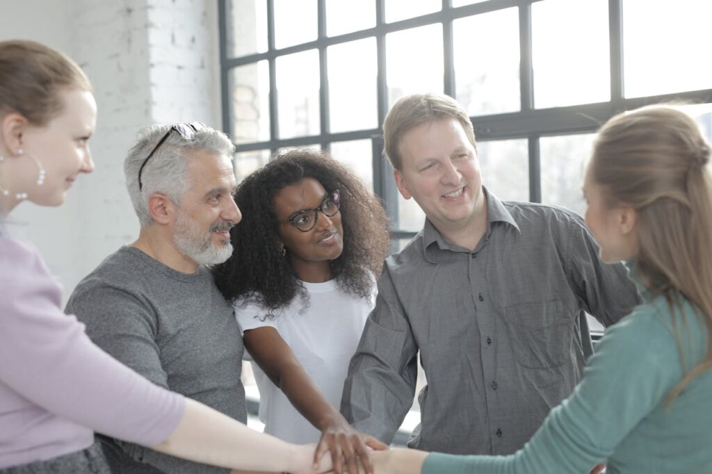 group of people holding hands group of people holding hands