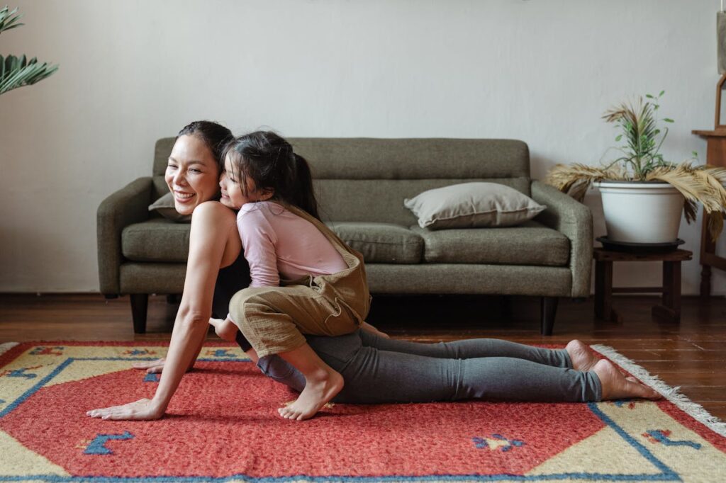 mom and daughter enjoy yoga routine