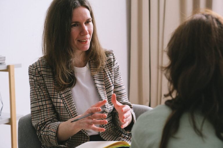 woman speaking to other person