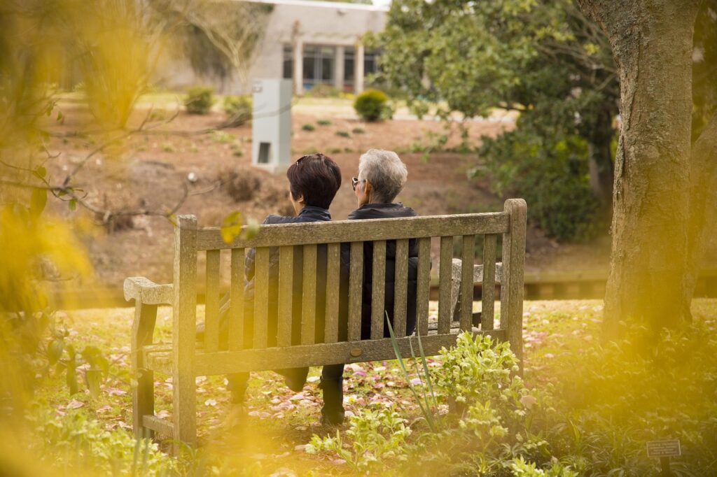 two people sitting on the bench