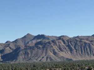 Dry mountain range under a clear blue sky.