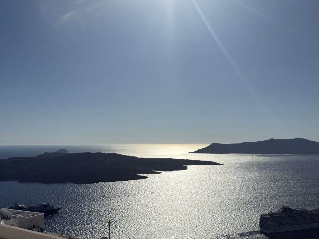 Sunlit sea, distant islands, stillness.