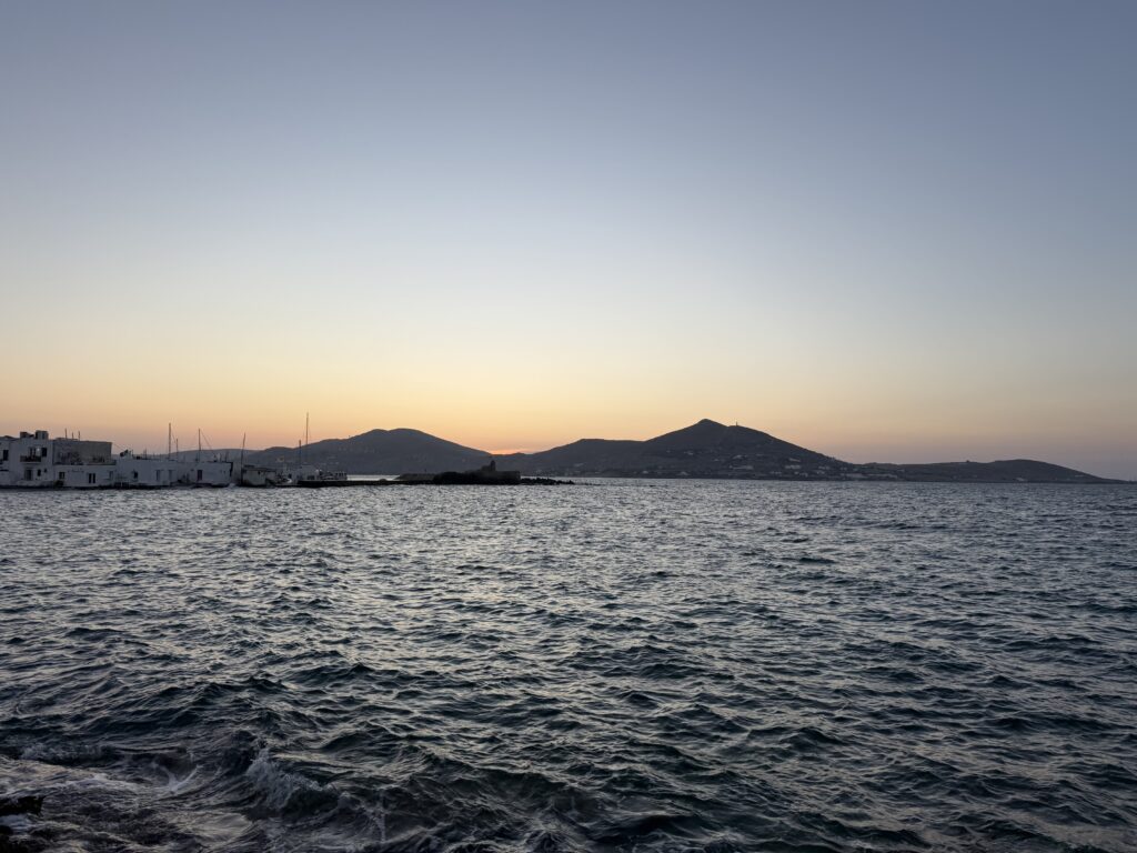 Golden dusk over quiet coastal waters