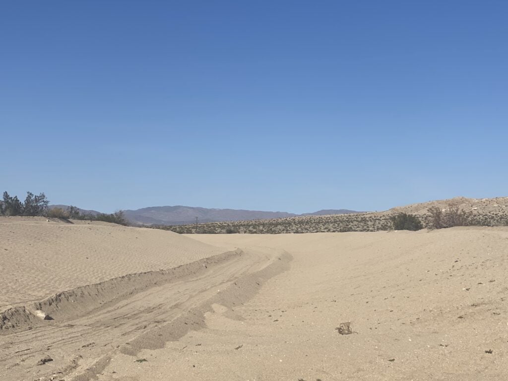 A quiet desert landscape with soft sand