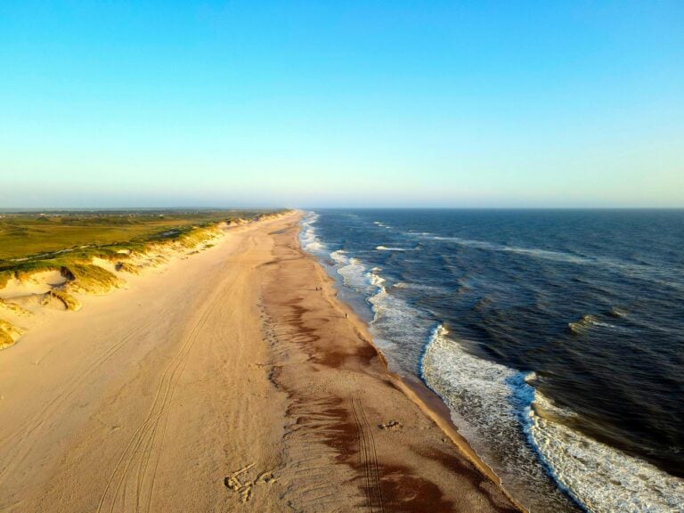 beach with crashing waves and golden sands